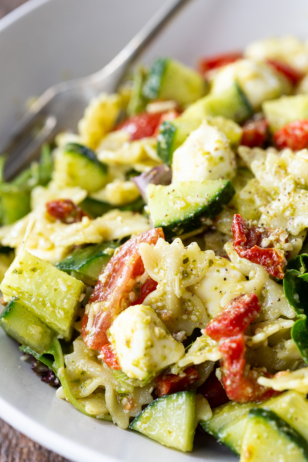 Pesto pasta salad, made with 9 ingredients, and perfect for summer potlucks. 