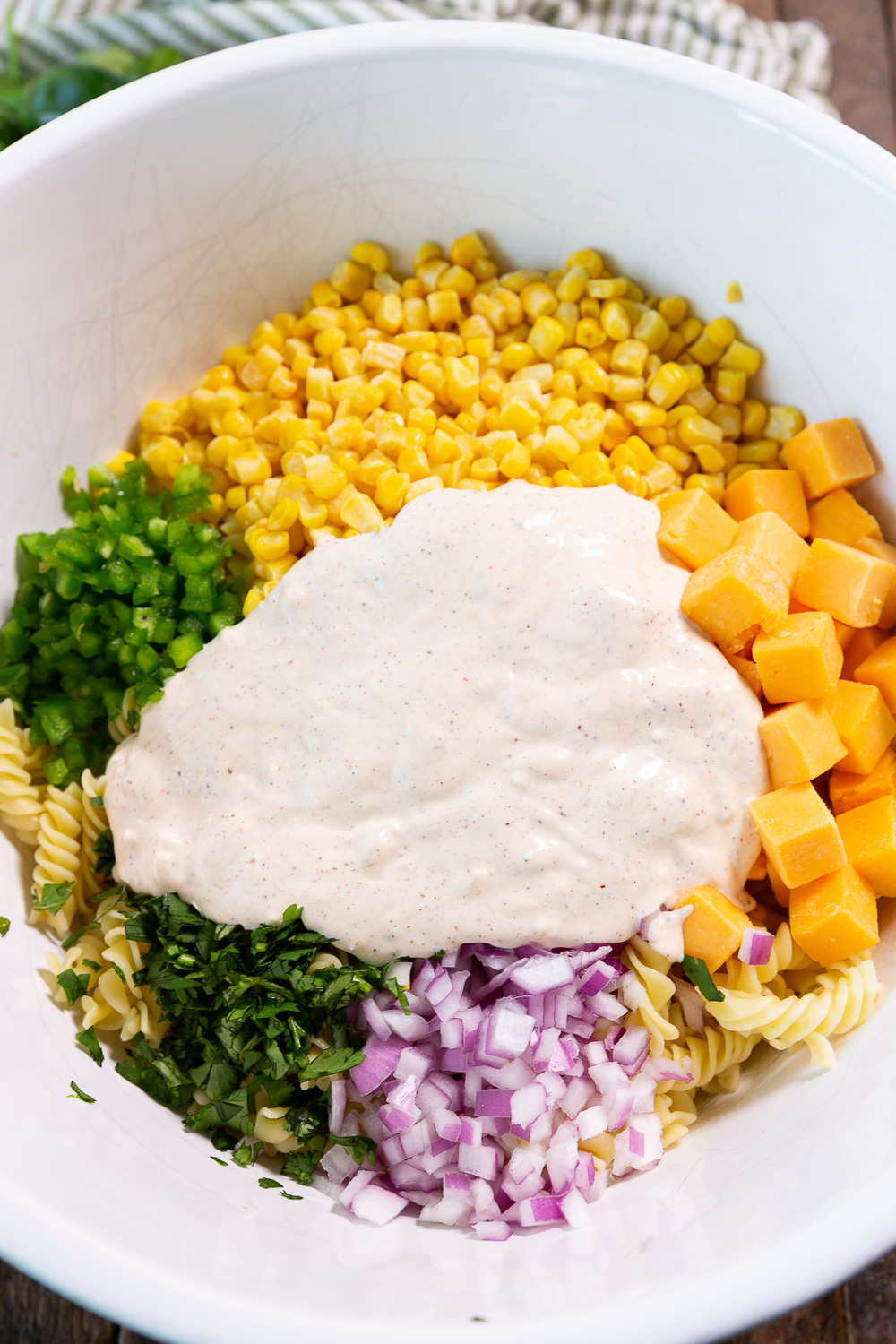Street corn pasta salad with a delicious elote inspired dressing. 