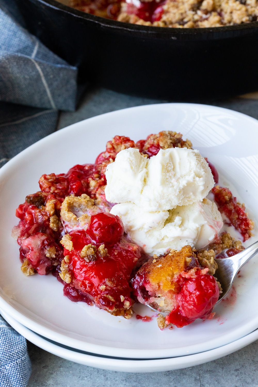 Cherry Cobbler, a tart cherry cobbler made in a dutch oven or cast iron skillet.
