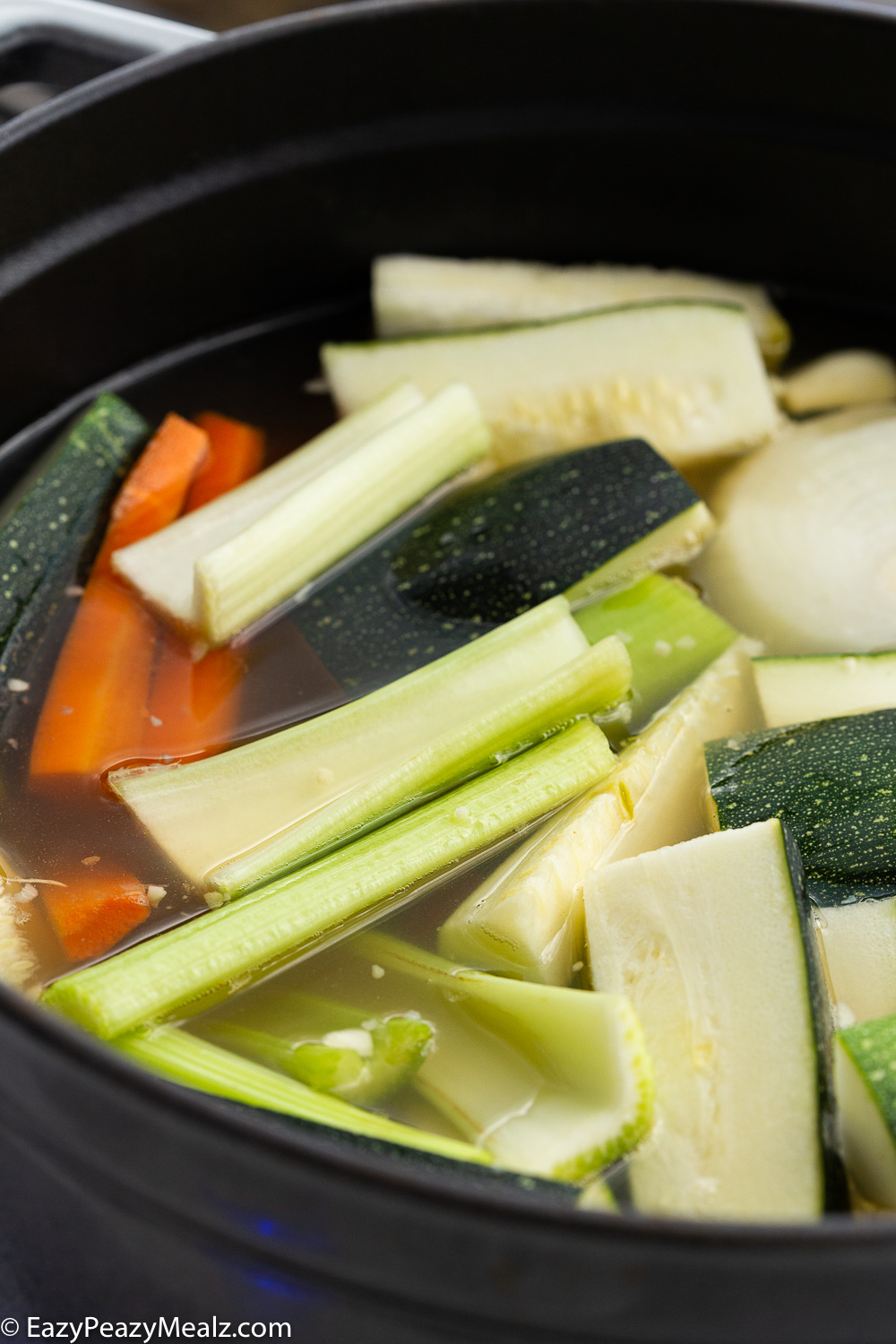A pot full of Italian Orzo Soup, before it is blended 