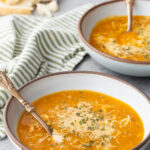Two bowls of Italian orzo soup, a nourishing delicious soup