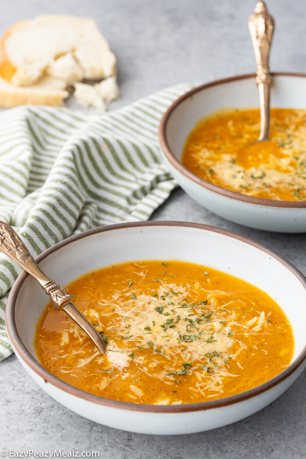 Two bowls of Italian orzo soup, a nourishing delicious soup