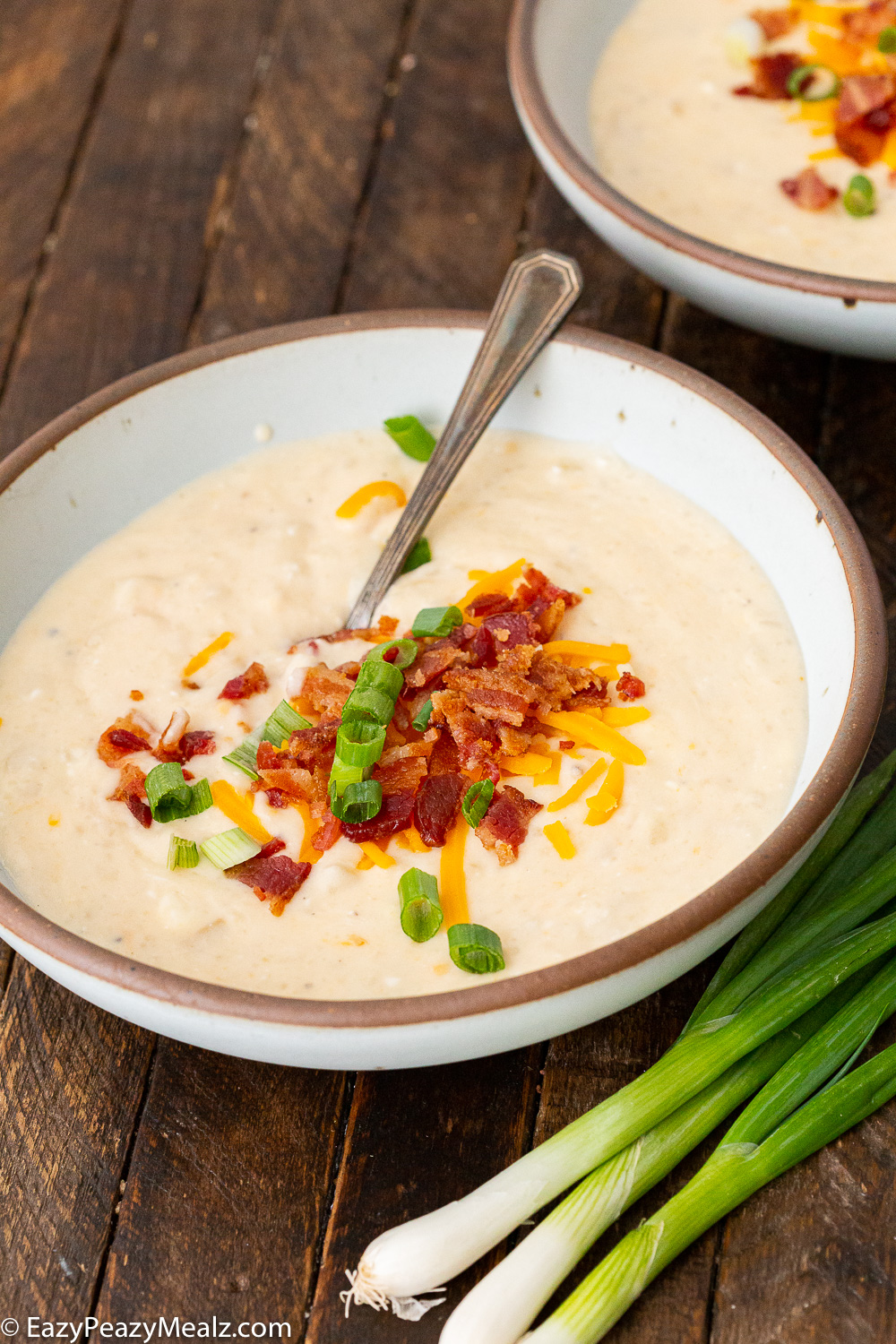 Baked potato soup loaded with toppings and cooked in the slow cooker