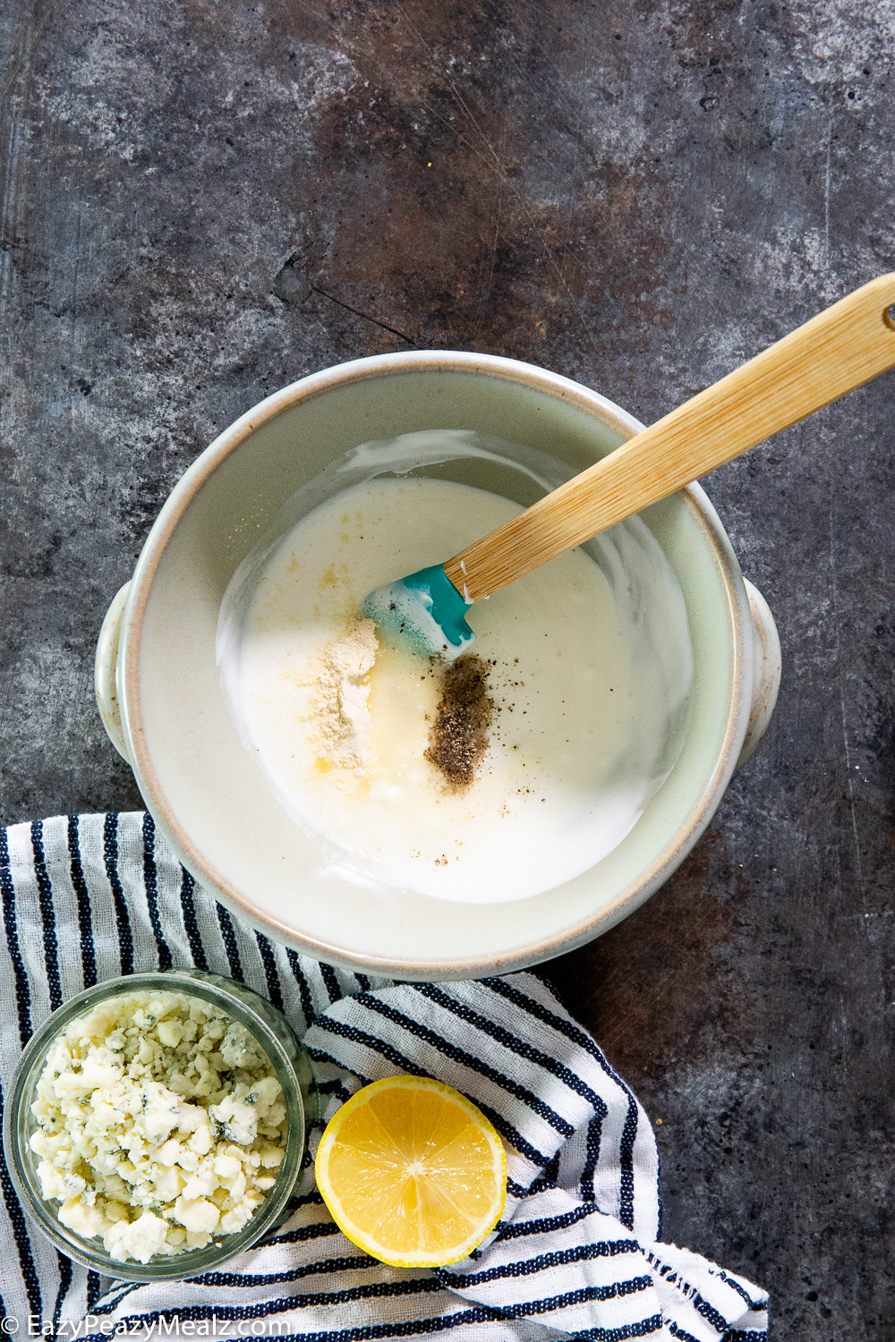 Making blue cheese dressing. 