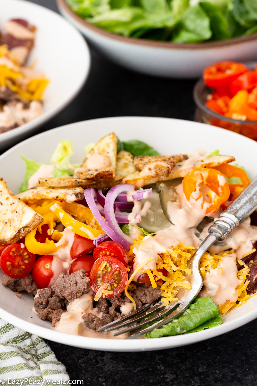 Burger bowl, a delicious deconstructed burger in a lettuce forward bowl 