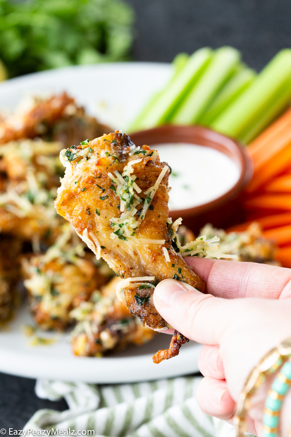 Crispy Garlic Parmesan Chicken Wings: these crispy baked chicken wings are tossed in a buttery herb garlic parmesan sauce. 