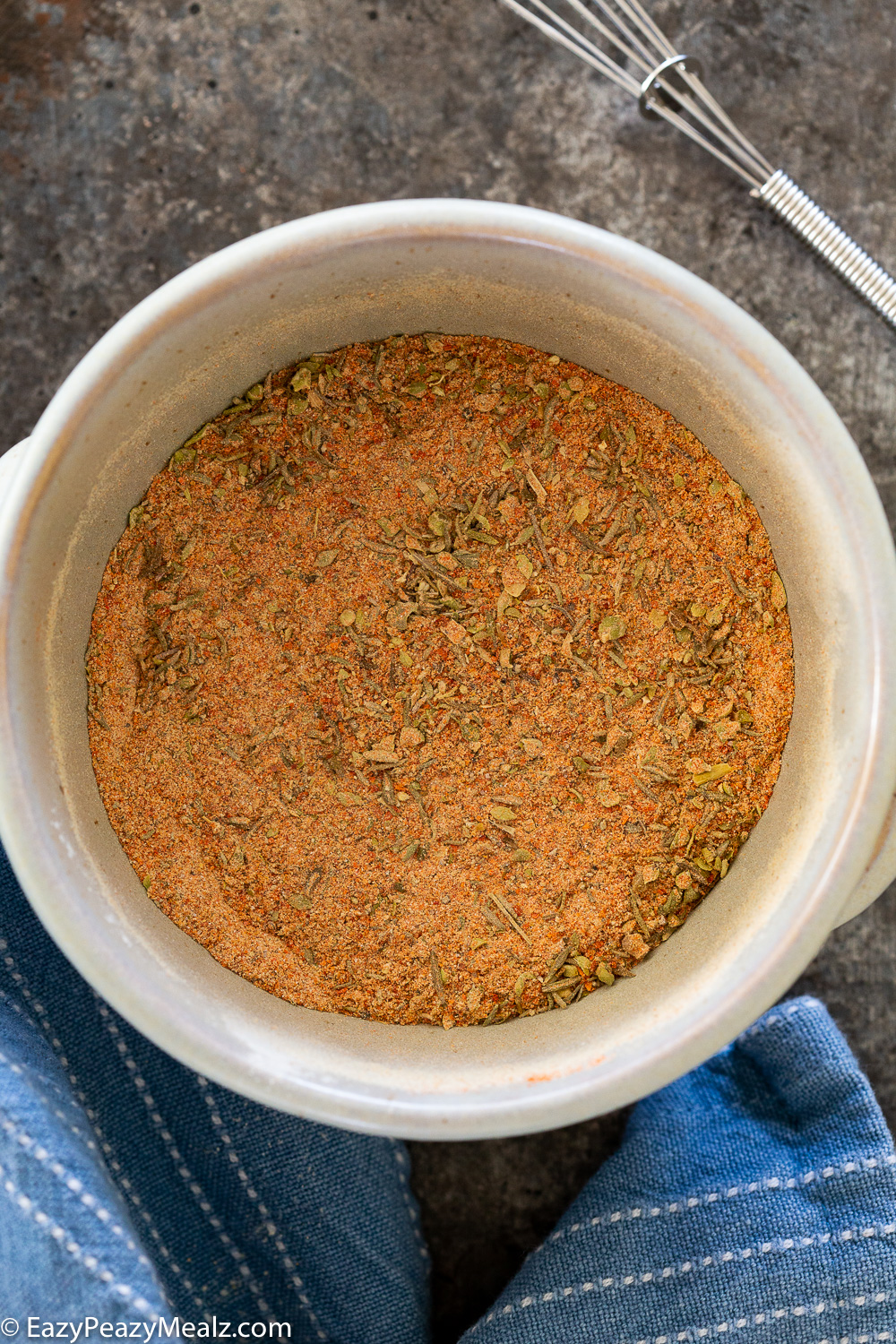 Mixing together a homemade seasoning blend