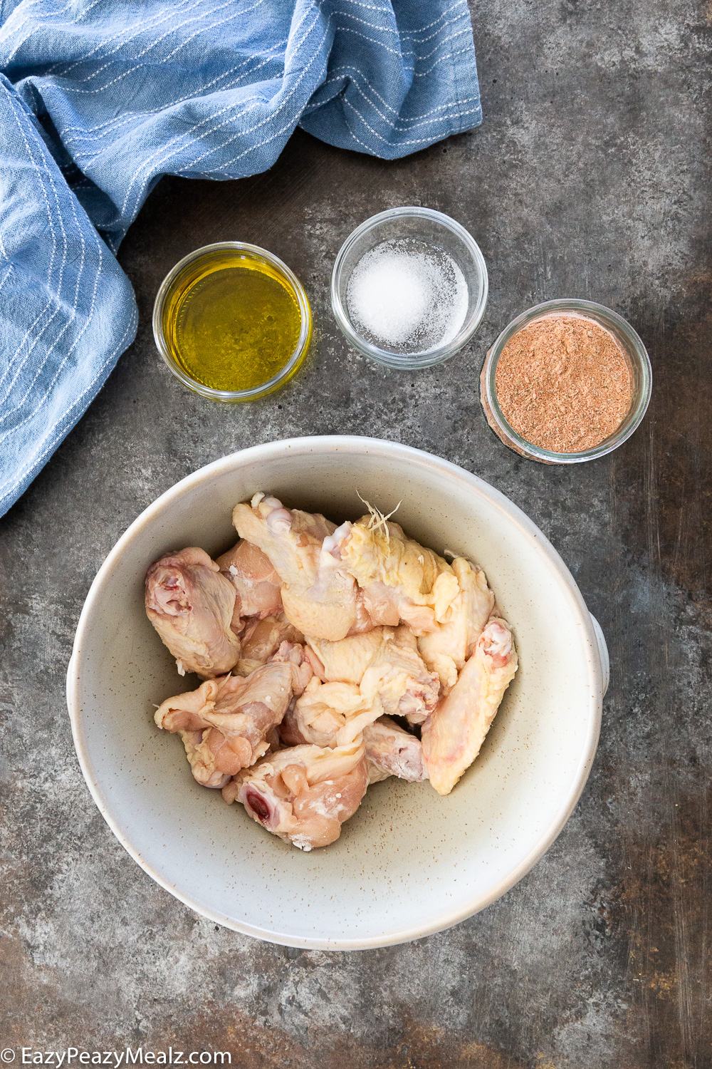 Cajun wings, chicken wings and the needed ingredients for cajun wings