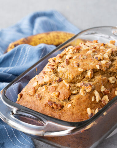 A loaf of banana nutbread in a glass pan