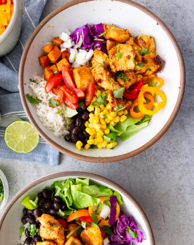 Chicken burrito bowls- Easy chicken burrito bowls packed with juicy seasoned chicken, rice, beans, veggies, and all your favorite toppings. A quick, customizable meal the whole family will love!