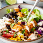Chicken burrito bowls with hot honey chipotle chicken, sweet potatoes, black beans, cilantro lime rice and more