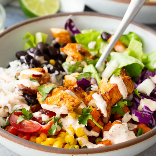 Chicken burrito bowls with hot honey chipotle chicken, sweet potatoes, black beans, cilantro lime rice and more