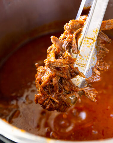 Instant Pot Birria is a bold, rich, and deeply flavorful Mexican dish made faster and easier thanks to pressure cooking. Traditionally slow-simmered for hours, this shortcut version uses the Instant Pot to tenderize beef until it's fall-apart soft in a fraction of the time. The meat is cooked in a spiced broth made from dried chilies, garlic, onions, tomatoes, and warm, aromatic spices like cumin, oregano, and cinnamon. Once done, the beef is shredded and can be enjoyed in tacos, quesabirria (crispy, cheesy tacos dipped in the broth), or served with a side of the intensely flavorful consommé for dunking. It’s comfort food with a kick—hearty, satisfying, and bursting with authentic flavor.