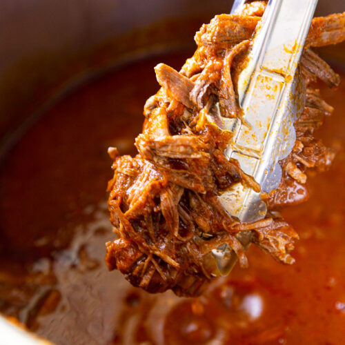 Instant Pot Birria is a bold, rich, and deeply flavorful Mexican dish made faster and easier thanks to pressure cooking. Traditionally slow-simmered for hours, this shortcut version uses the Instant Pot to tenderize beef until it's fall-apart soft in a fraction of the time. The meat is cooked in a spiced broth made from dried chilies, garlic, onions, tomatoes, and warm, aromatic spices like cumin, oregano, and cinnamon. Once done, the beef is shredded and can be enjoyed in tacos, quesabirria (crispy, cheesy tacos dipped in the broth), or served with a side of the intensely flavorful consommé for dunking. It’s comfort food with a kick—hearty, satisfying, and bursting with authentic flavor.