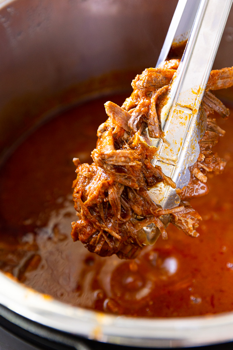 Instant Pot Birria is a bold, rich, and deeply flavorful Mexican dish made faster and easier thanks to pressure cooking. Traditionally slow-simmered for hours, this shortcut version uses the Instant Pot to tenderize beef until it's fall-apart soft in a fraction of the time. The meat is cooked in a spiced broth made from dried chilies, garlic, onions, tomatoes, and warm, aromatic spices like cumin, oregano, and cinnamon. Once done, the beef is shredded and can be enjoyed in tacos, quesabirria (crispy, cheesy tacos dipped in the broth), or served with a side of the intensely flavorful consommé for dunking. It’s comfort food with a kick—hearty, satisfying, and bursting with authentic flavor.