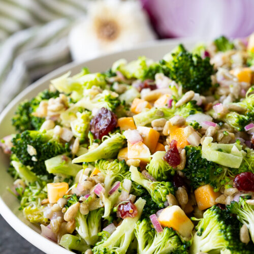 Fresh, crunchy broccoli salad tossed with sunflower seeds, cheese cubes, and dried cranberries, all coated in a tangy honey mustard dressing. Easy, make-ahead, and perfect for potlucks or healthy lunches!