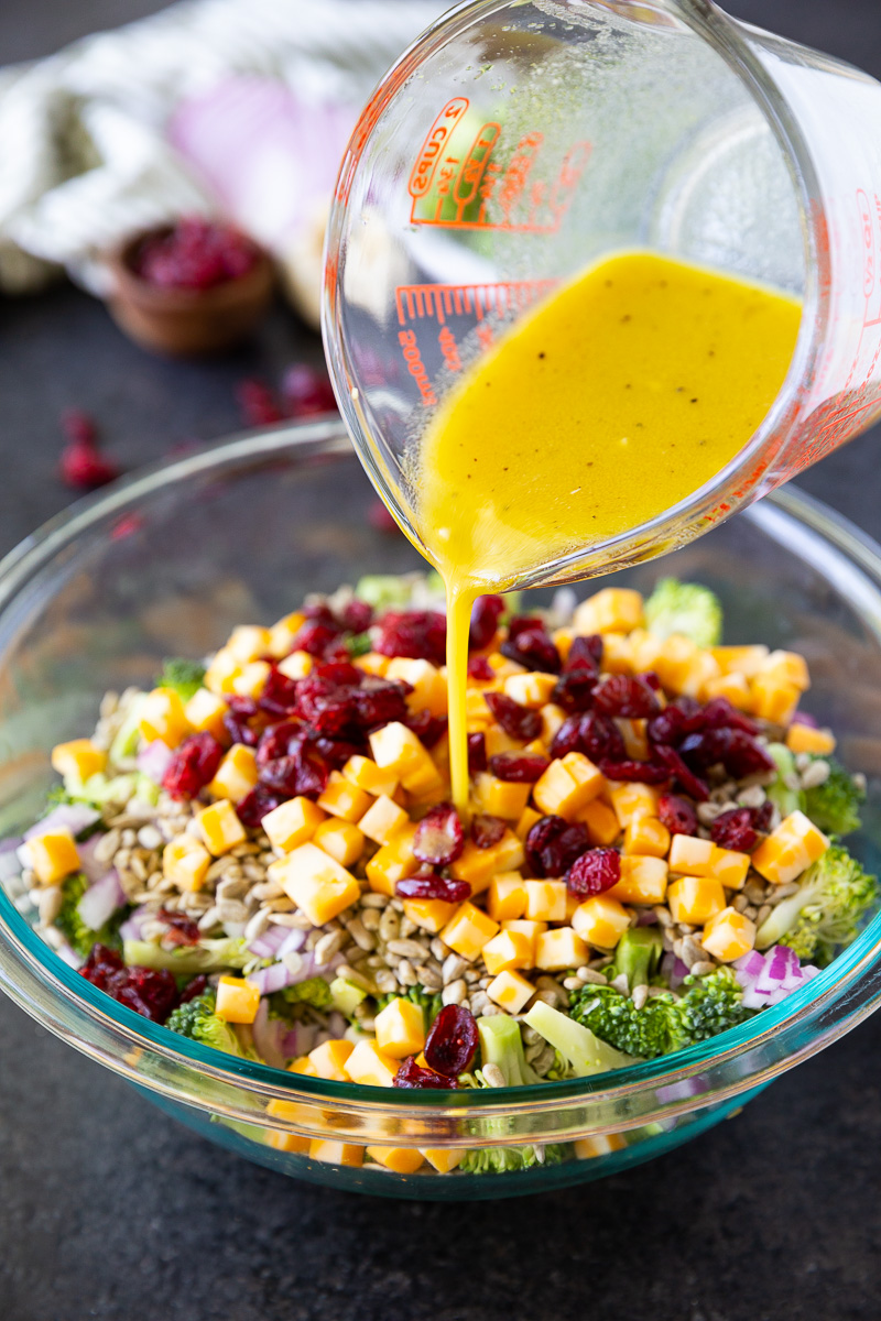 Fresh, crunchy broccoli salad tossed with sunflower seeds, cheese cubes, and dried cranberries, all coated in a tangy honey mustard dressing. Easy, make-ahead, and perfect for potlucks or healthy lunches!