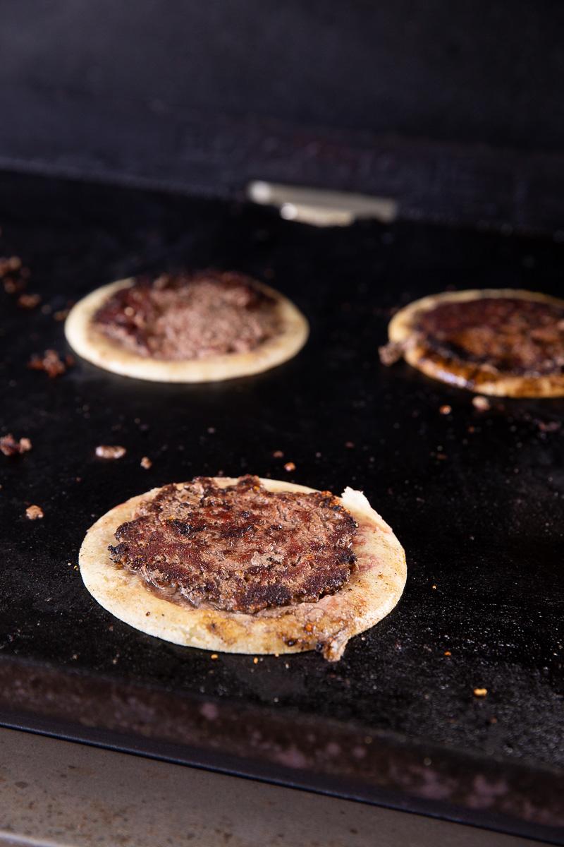 Smashburger tacos on the griddle. 