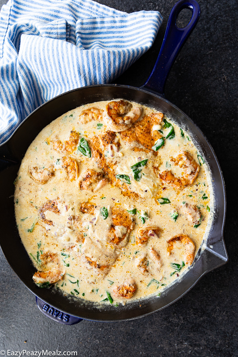This Cajun salmon and shrimp recipe is packed with bold flavor and served in a creamy spinach cheese sauce. Easy to make, comforting, and perfect for a quick dinner!