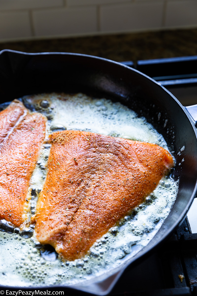 Cooking salmon for cajun salmon and shrimp in creamy cheese sauce