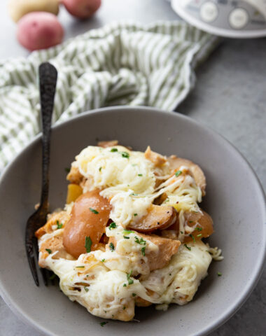 Make dinnertime easy with this Slow Cooker Garlic Parmesan Chicken and Potatoes recipe! Juicy chicken, tender potatoes, and a rich garlic-parmesan sauce come together in one comforting, family-friendly meal.