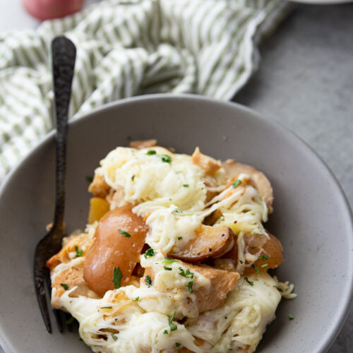 Make dinnertime easy with this Slow Cooker Garlic Parmesan Chicken and Potatoes recipe! Juicy chicken, tender potatoes, and a rich garlic-parmesan sauce come together in one comforting, family-friendly meal.