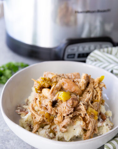 Slow cooker Mississippi Chicken over mashed potatoes