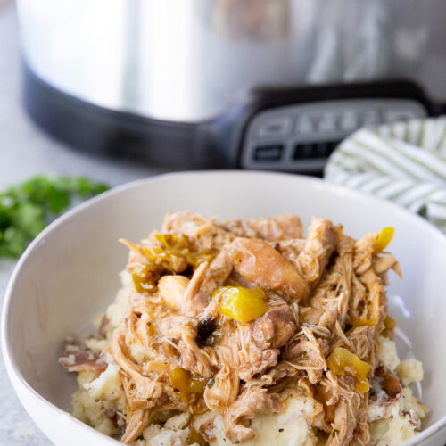 Slow cooker Mississippi Chicken over mashed potatoes