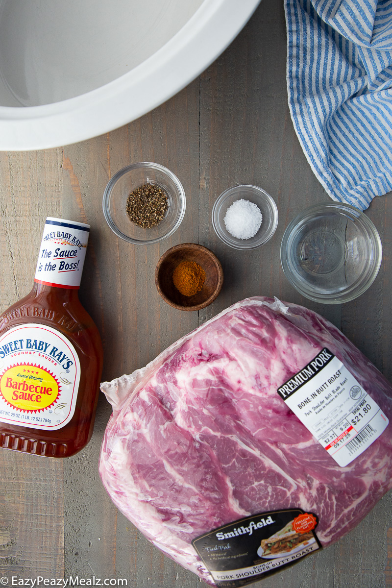 Ingredients for slow cooker pulled pork: pork, salt and pepper, water, cayenne, and BBQ sauce. 