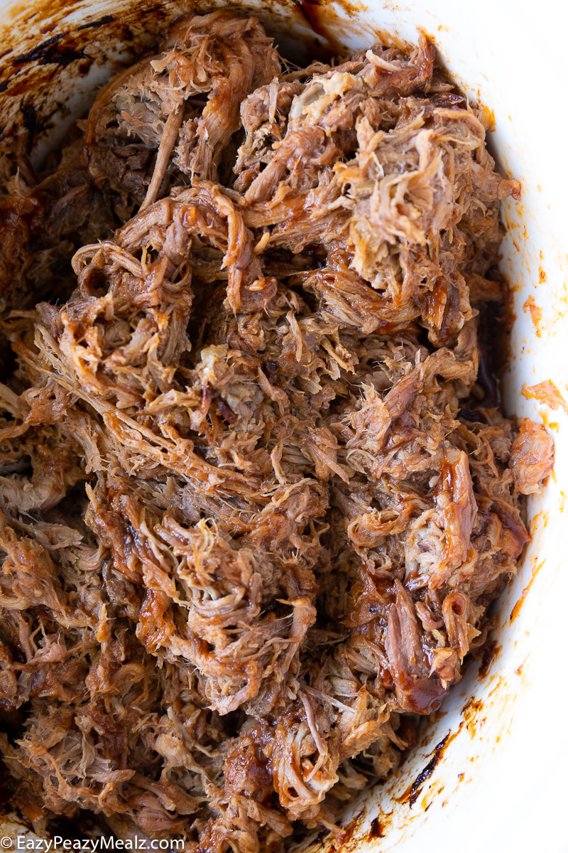 Tender, juicy pulled pork cooked low and slow in the crockpot, shredded and coated in rich barbecue sauce, ready for sandwiches, tacos, or meal prep.