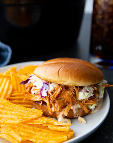 Tender, juicy slow cooker zesty BBQ chicken shredded and coated in a rich, tangy barbecue sauce, perfect for sandwiches, wraps, or weeknight dinners.