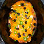 Slow Cooker chicken enchiladas topped
