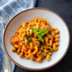 Slow cooker chicken pasta, tender chicken, rich sauce, cheesy perfection.