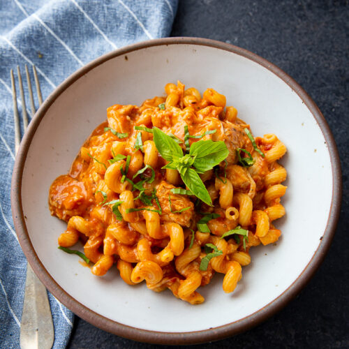 Slow cooker chicken pasta, tender chicken, rich sauce, cheesy perfection.