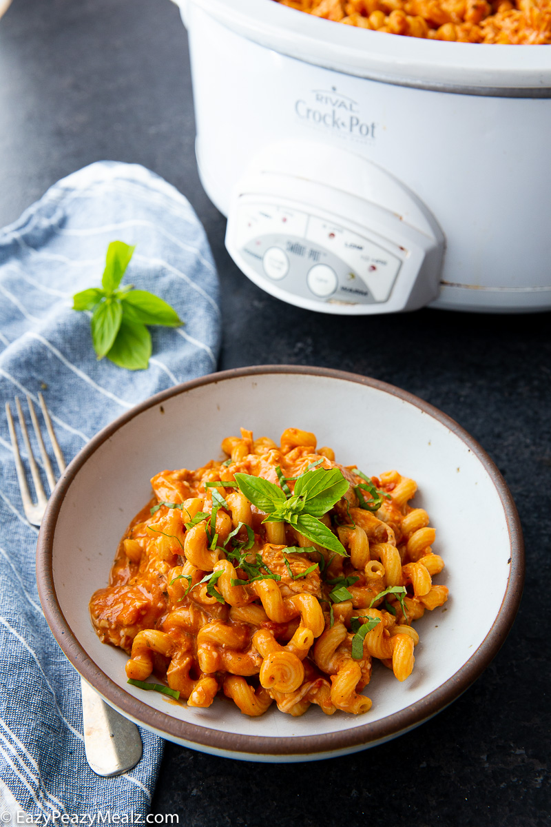 Slow cooker chicken pasta with a creamy alfredo marinara sauce