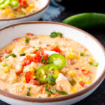 Slow Cooker creamy chicken taco soup in a bowl with toppings