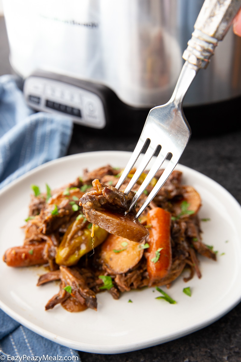 Slow Cooker Mississippi Roast, a tender roast and vegetable dish.
