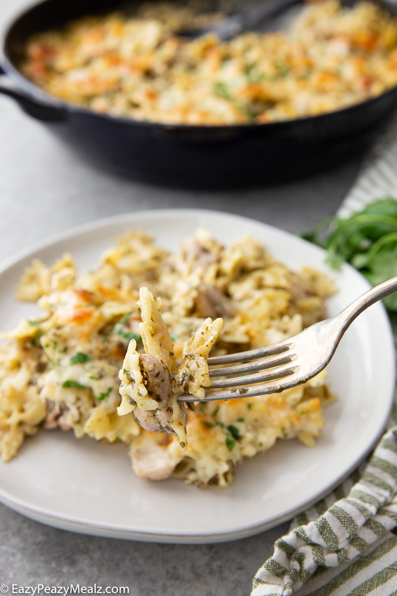 A fork full of pesto chicken pasta bake