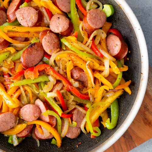 A skillet full of sausage and peppers