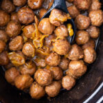 A slow cooker full of mississippi meatballs, tangy, tasty, and delicious.