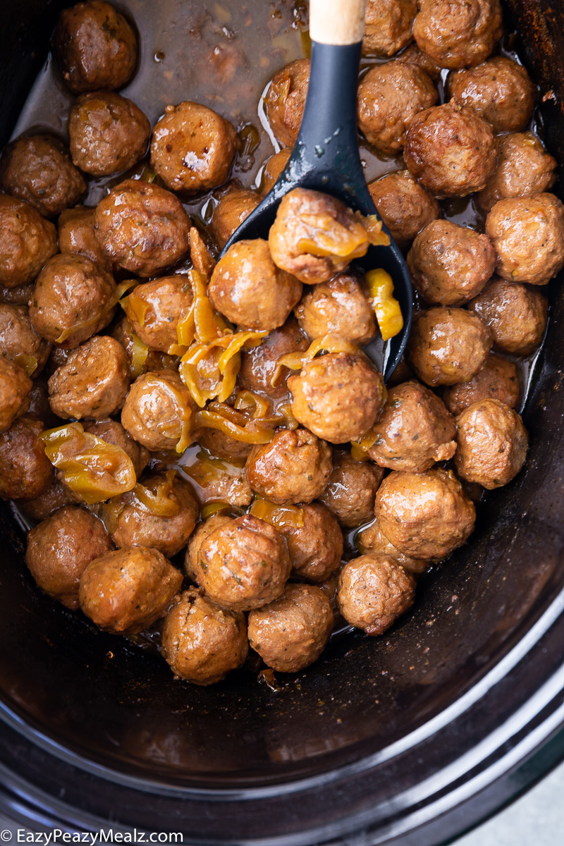 A slow cooker full of mississippi meatballs, tangy, tasty, and delicious.