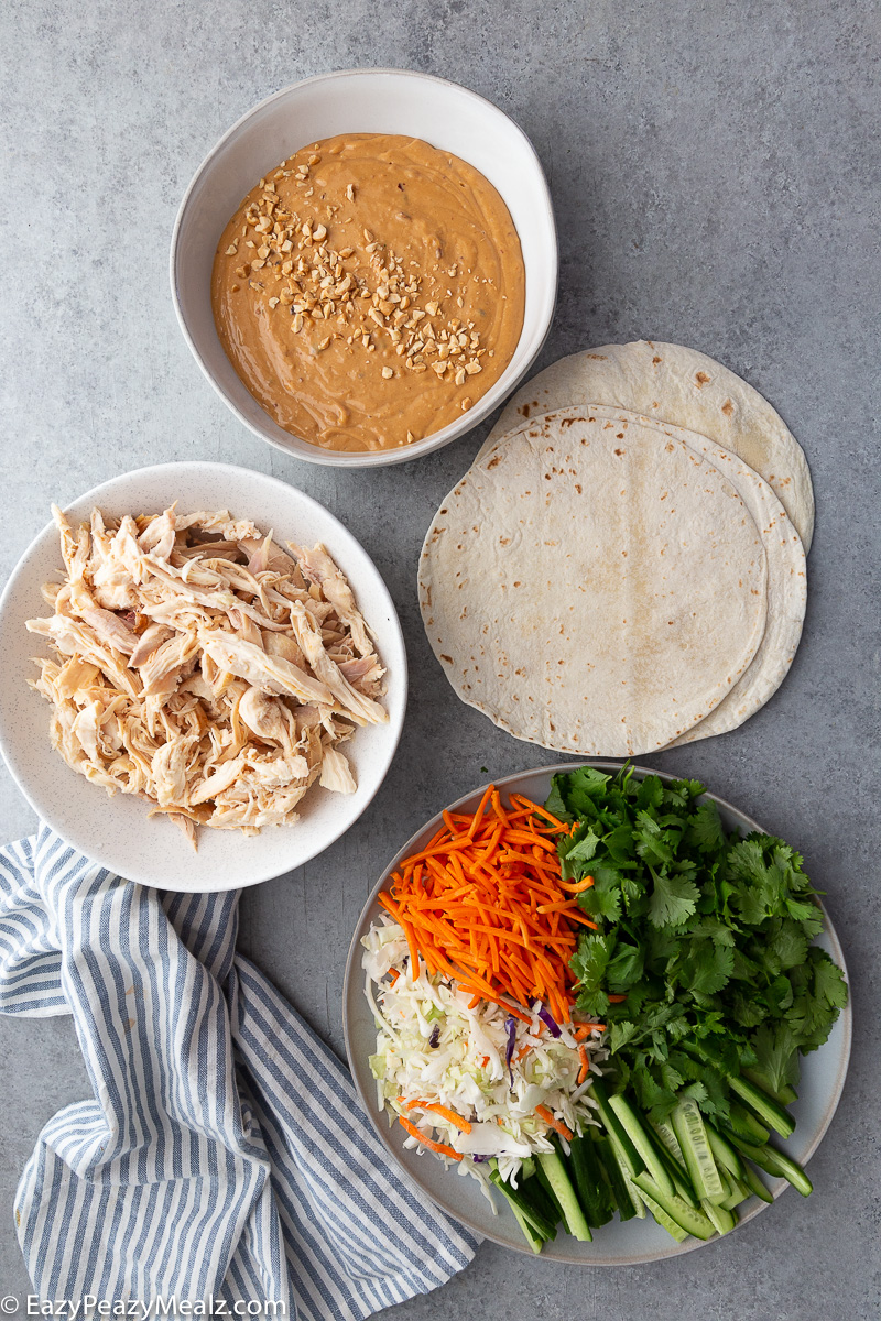Thai peanut wraps, creamy peanut sauce covered chicken and wraps