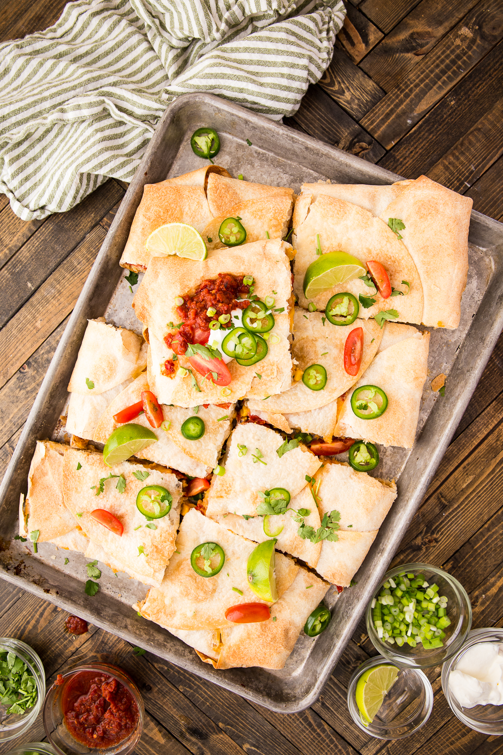 A tray of chicken quesadillas made on a sheet pan and baked in the oven. 