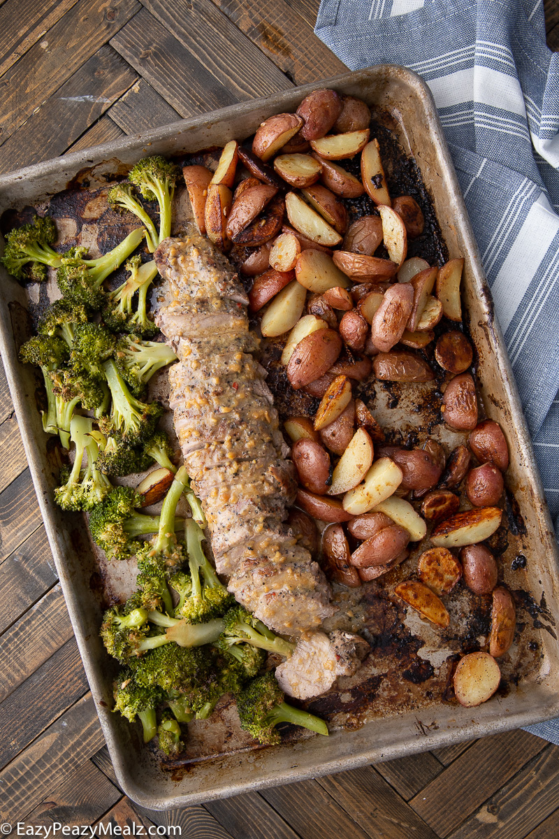A sheet pan full of garlic butter maple dijon pork tenderloin