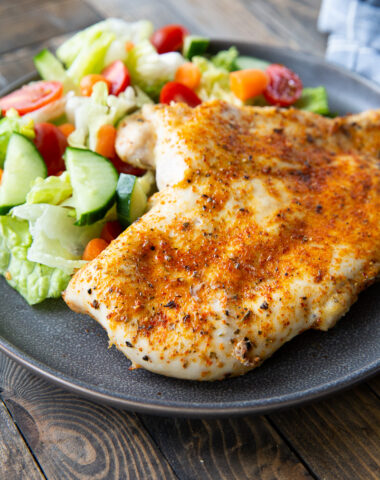 A plate of juicy baked chicken breasts