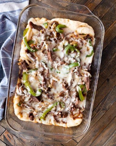 A Philly Cheesesteak Bake, loaded with cheese, onions, peppers and steaks.