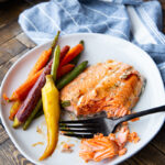 Maple Dijon Salmon cooked on a sheet pan with carrots and green beans.