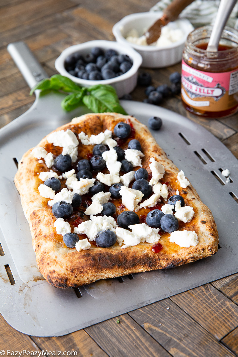 An uncooked flatbread pizza 