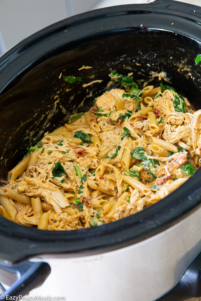 Marry me chicken pasta cooked in the slow cooker and topped with fresh parmesan cheese.
