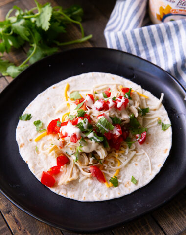 A slow cooker salsa verde chicken, made into a taco